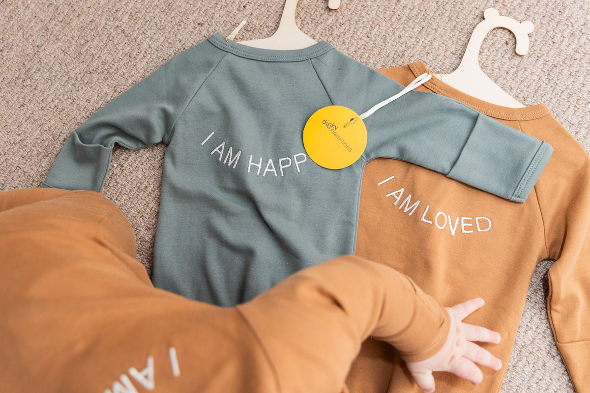 100% Organic Cotton Baby onesie with I AM LOVED Affirmation Embroidery