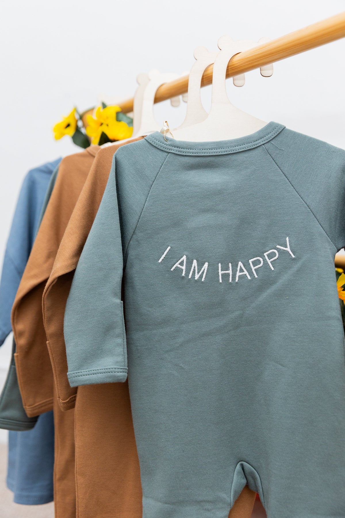 100% Organic Cotton Baby onesie with I AM HAPPY Affirmation Embroidery